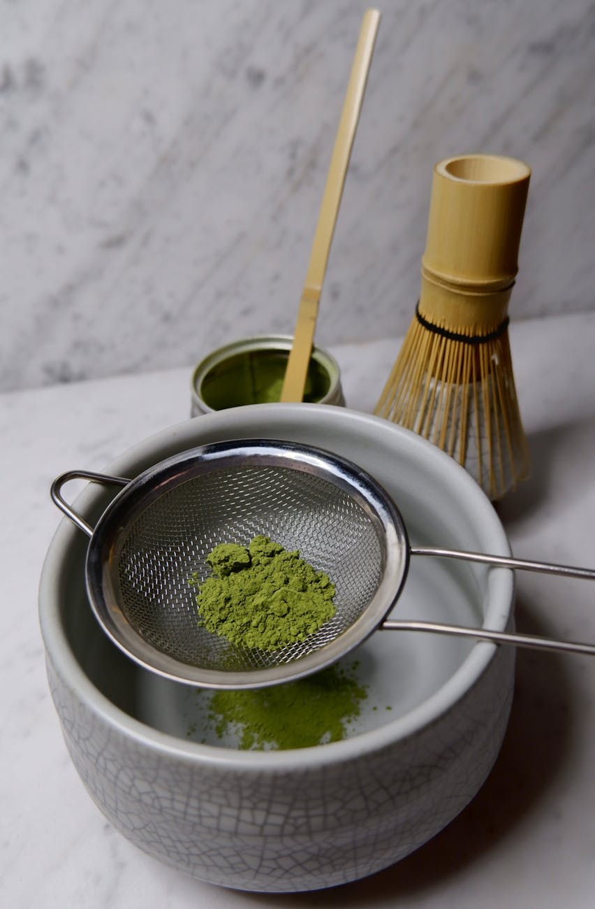 traditional matcha tea preparation with utensils